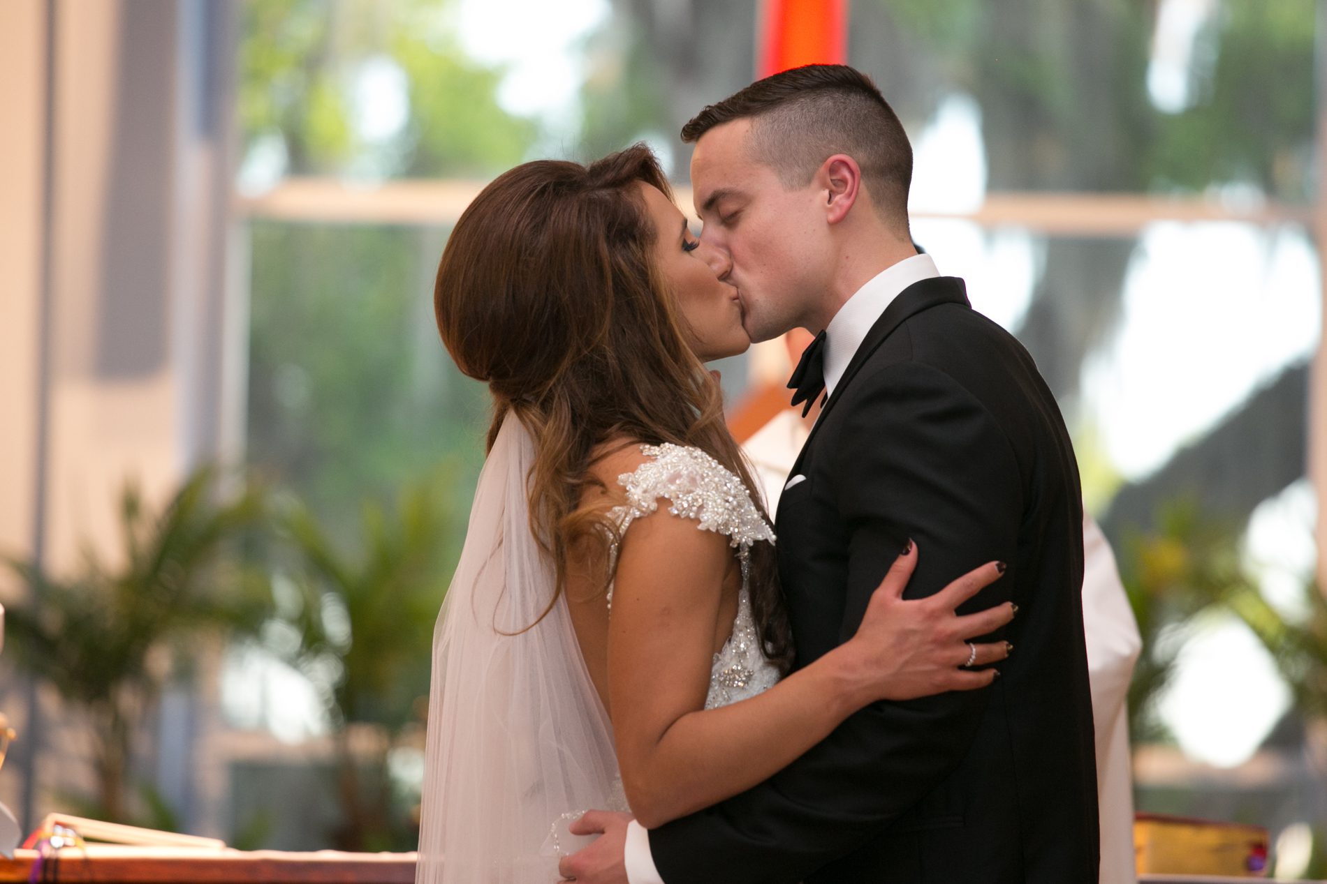 bride and groom kiss